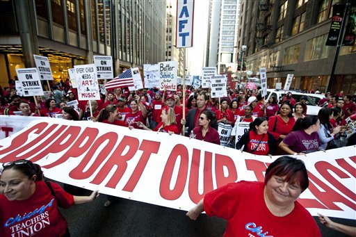Chicago Public School teachers strike in the front of the CPS headquarters in early September