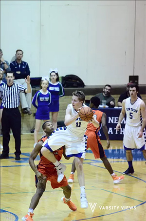 Evanston boys bball able to pull away from NT