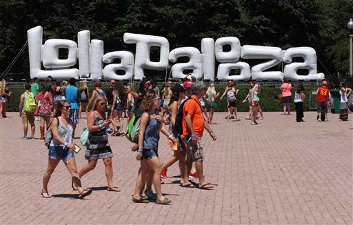 Music fans arrive on day 2 of Lollapalooza 2013 at Grant Park on Saturday, Aug. 3, 2013, in Chicago. (Photo by Steve Mitchell/Invision/AP)