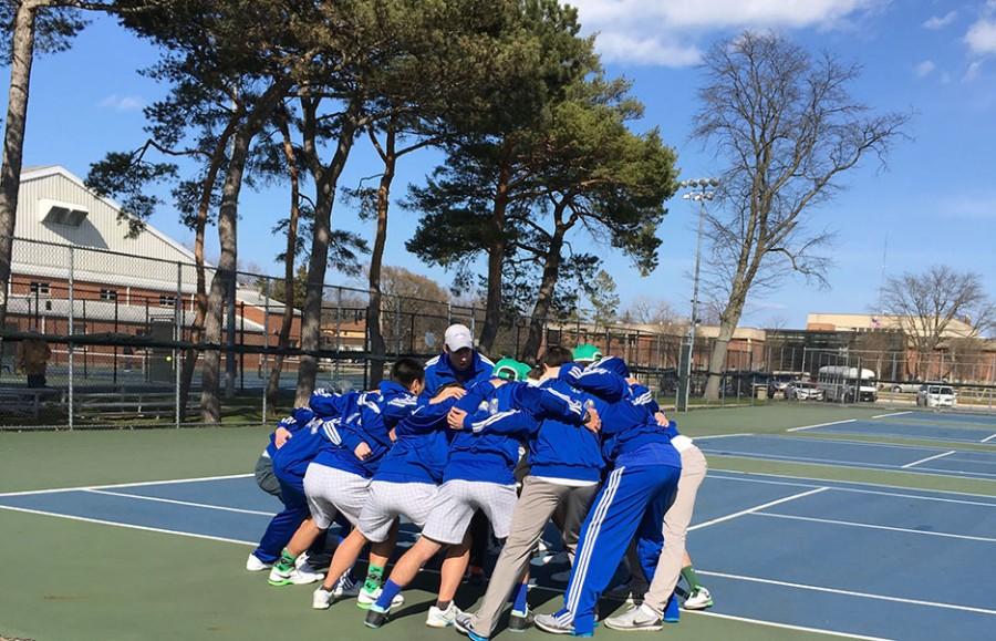 Boys+tennis+team+huddles+in+preparation+for+their+spring+season