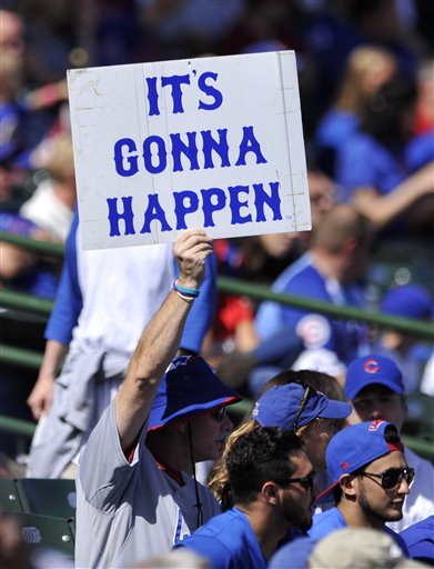 A Chicago Cubs fan holds a sign during a baseball game between the Chicago Cubs and St. Louis Cardinals Sunday, Sept. 20, 2015 in Chicago. (AP Photo/Paul Beaty)