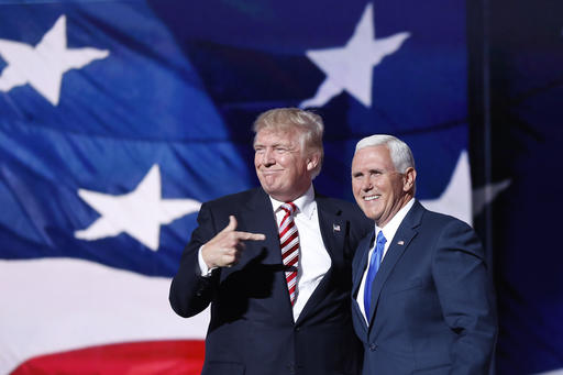 Republican presidential Candidate Donald Trump, points toward Republican Vice presidential candidate Gov. Mike Pence of Indiana after Pences acceptance speech during the third day session of the Republican National Convention in Cleveland, Wednesday, July 20, 2016. (AP Photo/Mary Altaffer)