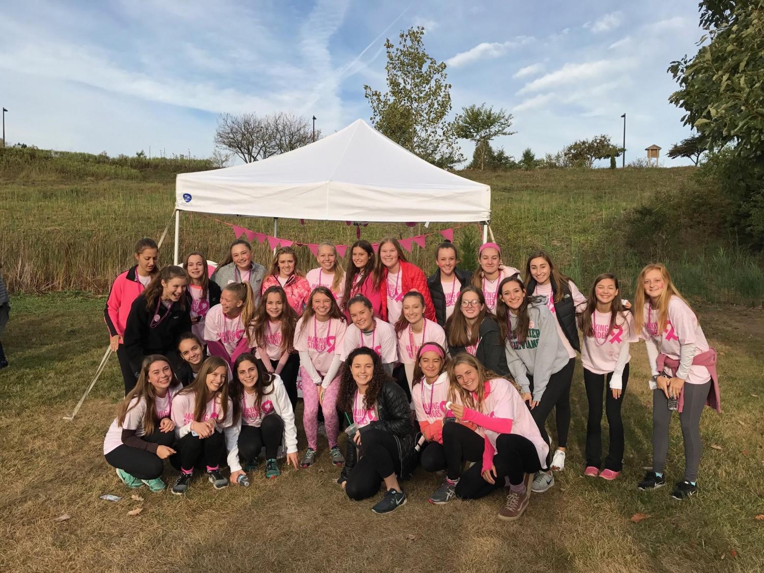 Junior Board is all smiles as they prepare to raise money to fight cancer in their matching pink shirts | Junior Board