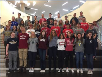 New Trier committed athletes pose for picture in Trevian commons | New Trier