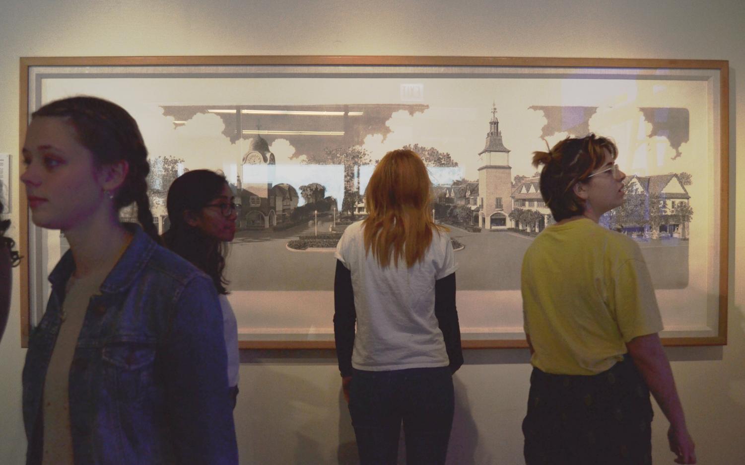 Students browse the newly opened Ann Brierly art gallery located on the second floor of the west wing