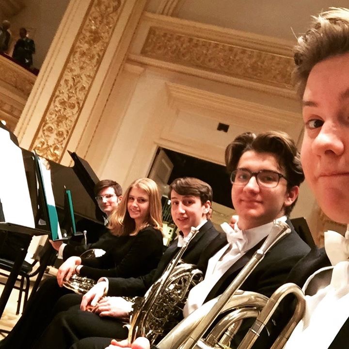 New Trier Symphony Orchestra’s french horn section posing for a selfie at New York’s Carnegie Hall 