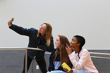 Juniors McKenna Fox, Shelby Jacob, and Summer Wheeler pose for a Snapchat selfie during a free period