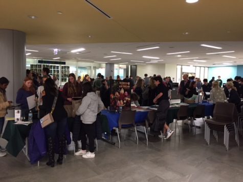 Students converse with potential employers in the Student Commons at the job fair on Oct. 16