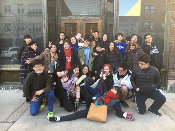 ESL students posed for a group picture in 2017 after seeing a play and having lunch in the community 