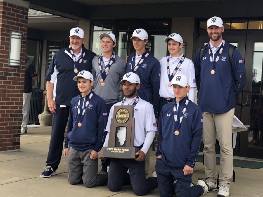 The boys golf team poses with their bronze medals after state on Oct. 19
