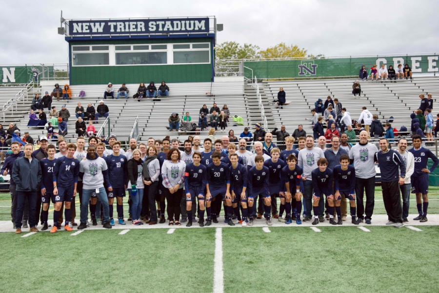 The team gathers before the game for teacher appreciation ceremony 