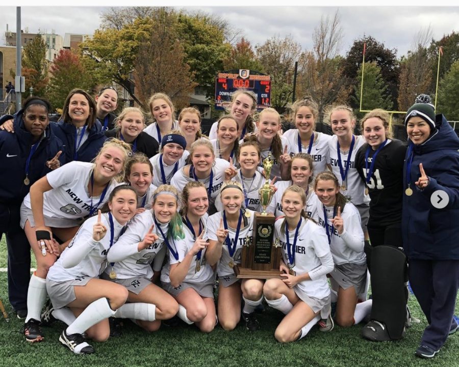 The field hockey team poses with their first-place trophy after the state final on Nov. 2 