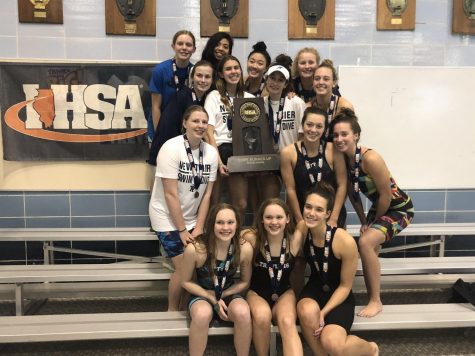 The team poses with their second place trophy following state on Nov. 23    