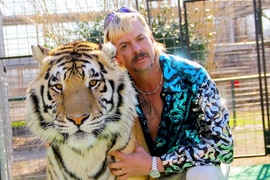 Joe Exotic with one of his tigers from the Netflix show Tiger King