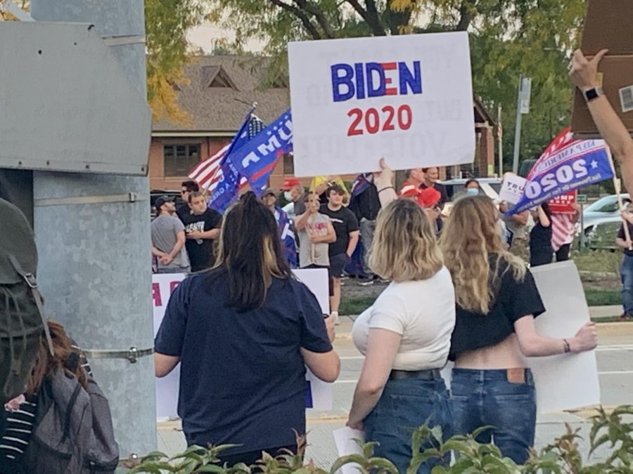 Biden and Trump voters proudly wave their flag at the Sep. 25 rally in Northbrook