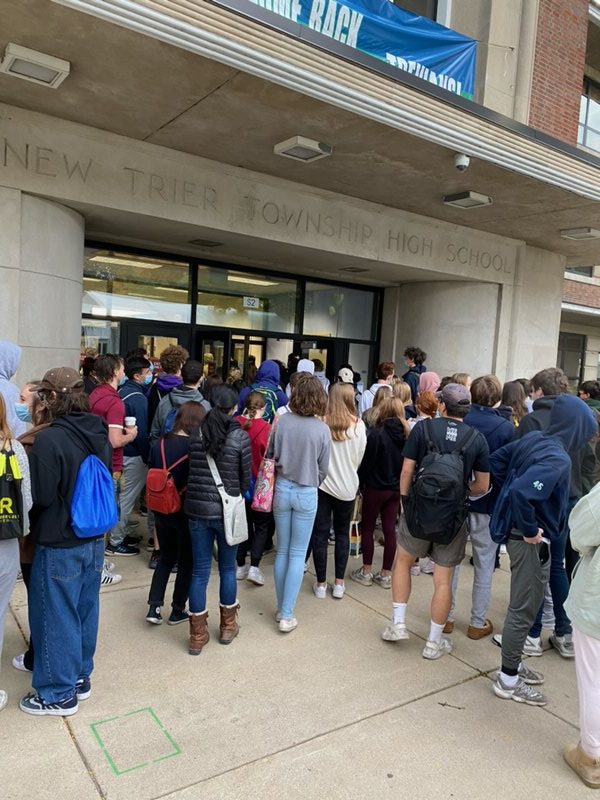 Students gather around the front entrance of the school waiting to be let in for the Oct. 14 SAT 