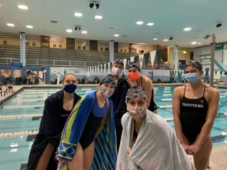 Swimmers pose at Fridays meet against Evanston