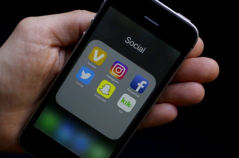 This photo shows social media app icons on a smartphone held by an Associated Press reporter 