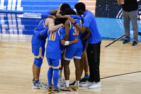 UCLA players huddle on the court after their heartbreaking Final Four loss against Gonzaga