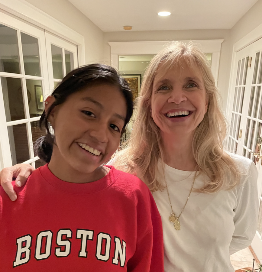 Dellamore (left) poses in a selfie with her adoptive mom, Nancy (right). Dellamore was adopted at 8 months old by a white family of 4