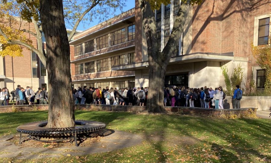 Students wait outside of the Winnetka Ave. entrance on Nov 8, 8:16am due to the slow-moving scanner process 