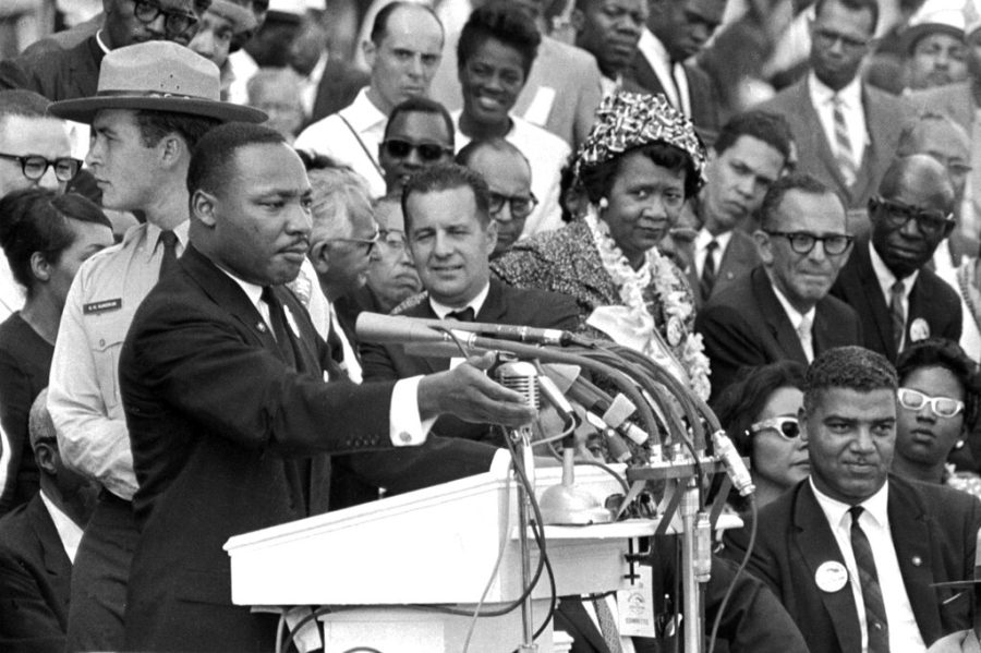 FILE - The Rev. Dr. Martin Luther King Jr., delivers his I Have a Dream speech in Washington, Aug. 28, 1963, as National Park Service ranger Gordon Gunny Gundrum, left, stands beside King. (AP Photo/File)