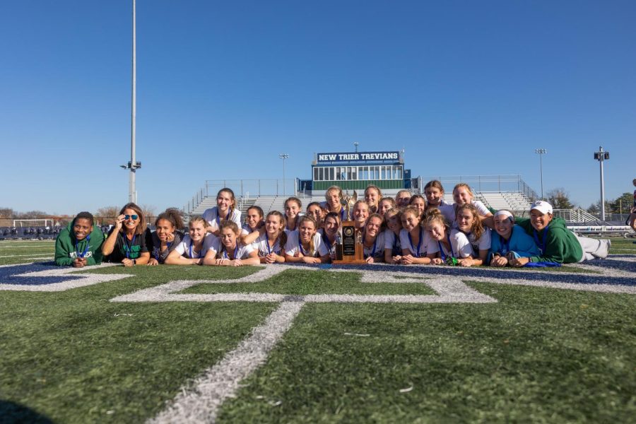 The team celebrates their fourth state championship in as many years after a 3-1 win against GBS on Oct. 29 