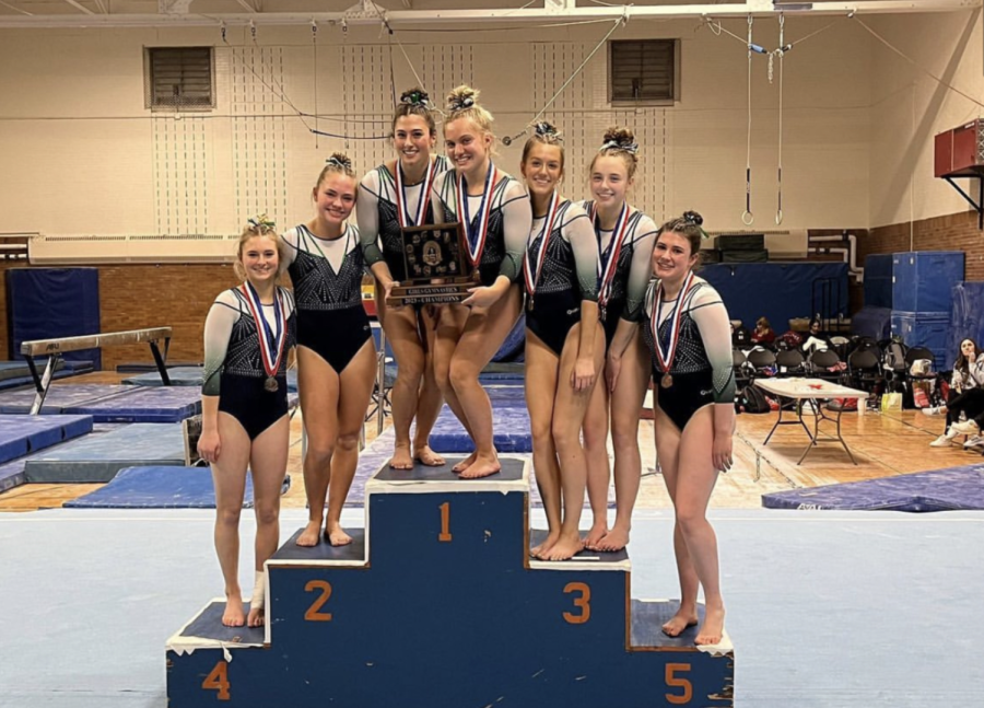 Gymnastics celebrates conference win at New Trier