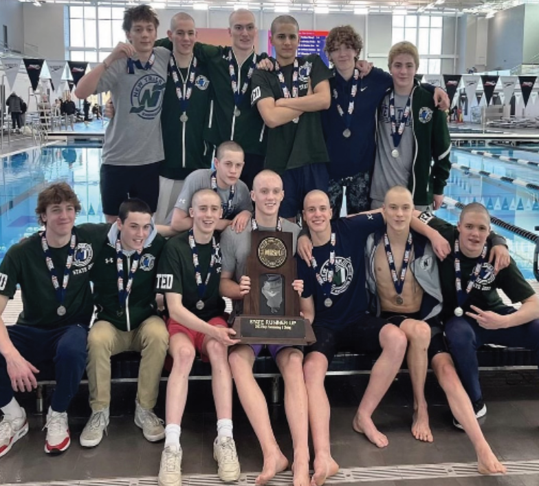 New+Trier+Boys+Swim+and+Dive+takes+picture+with+and+celebrates+hard-earned+2nd+place+trophy+at+the+IHSA+state+competition+on+Feb.+25+