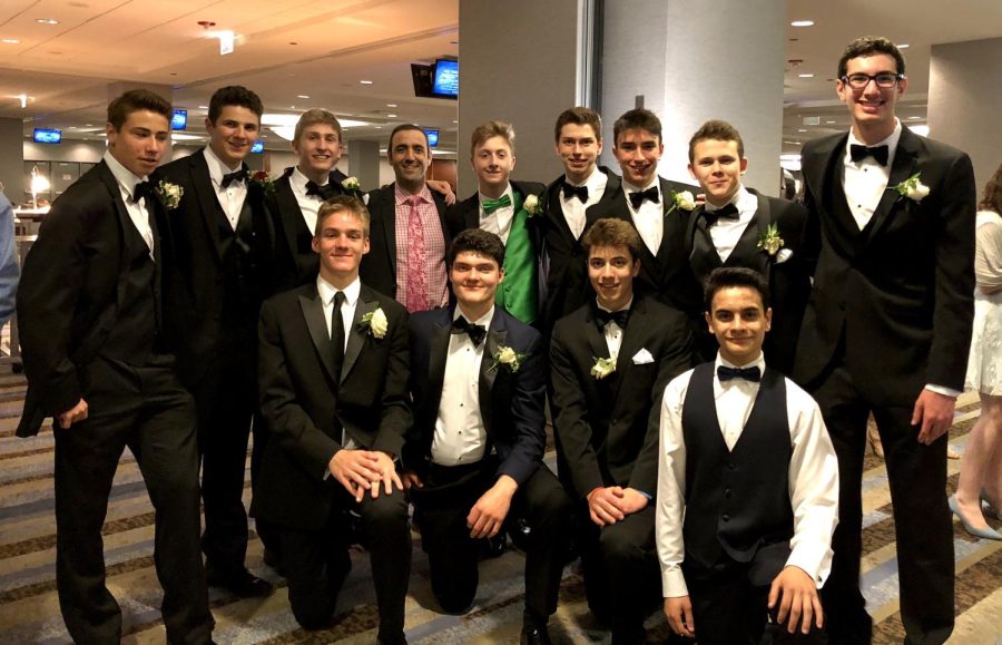 Mr. Trovato poses with his advisory during the 2019 prom at the Hyatt Regency. This prom will also be at the Hyatt Regency 6-10, and you have to get there before 7 and cannot leave until after 9.