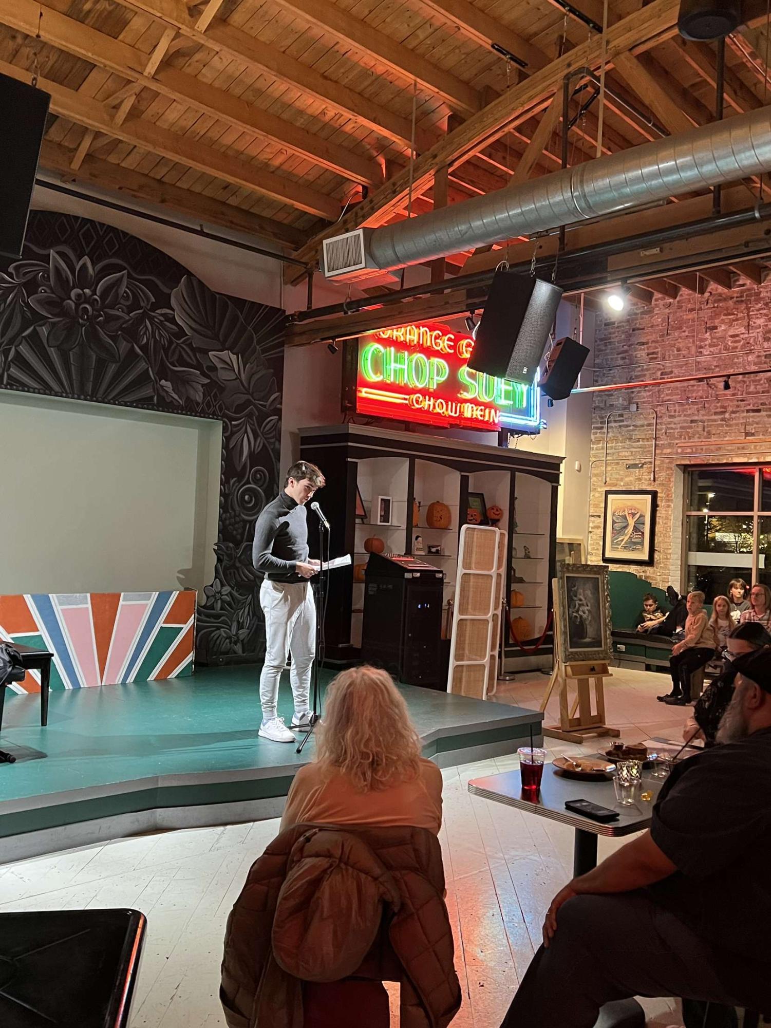 Student shares poetry at charity poetry reading hosted by Highland Park cafe Madame Zuzu
