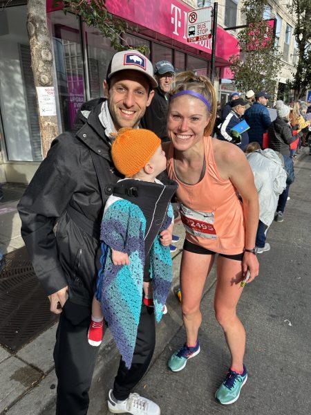 Loris with her husband and son after completing the Chicago Marathon on Oct. 8