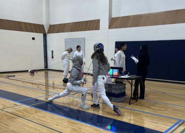 Senior saber fencer Yunqing Han jabs Culver Academy opponent to take 3-1 match lead on Dec. 2 meet at New Trier