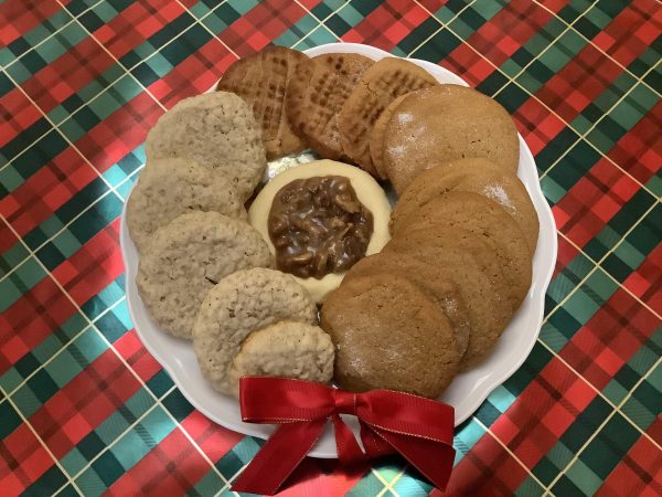 Pictured: Oatmeal Cinnamon Cookies (Left), Peanut Butter Cookies (Top), Gingerbread Cookies (Right), and Pecan Cookies (Center). All these recipes are easy to make and a perfect way to spend time with family.
