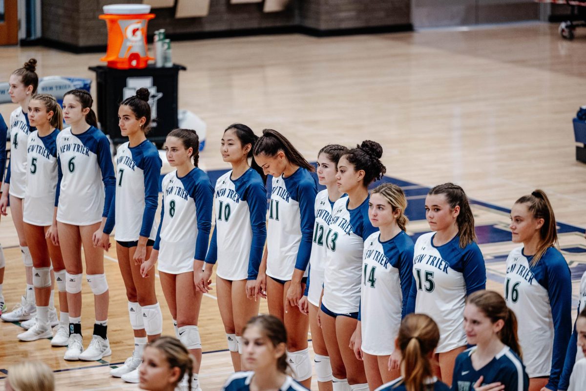 The girls volleyball team awaits lineup introductions on Sept. 14 against GBS