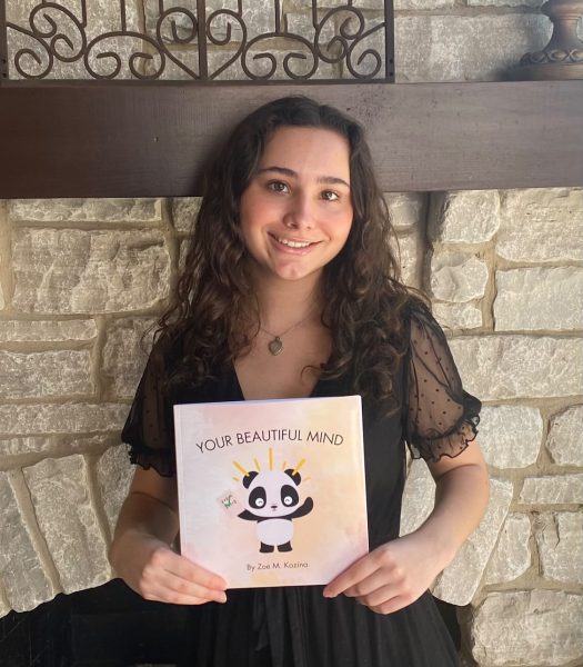 A photo of Kozina holding her book, 𝘠𝘰𝘶𝘳 𝘉𝘦𝘢𝘶𝘵𝘪𝘧𝘶𝘭 𝘔𝘪𝘯𝘥