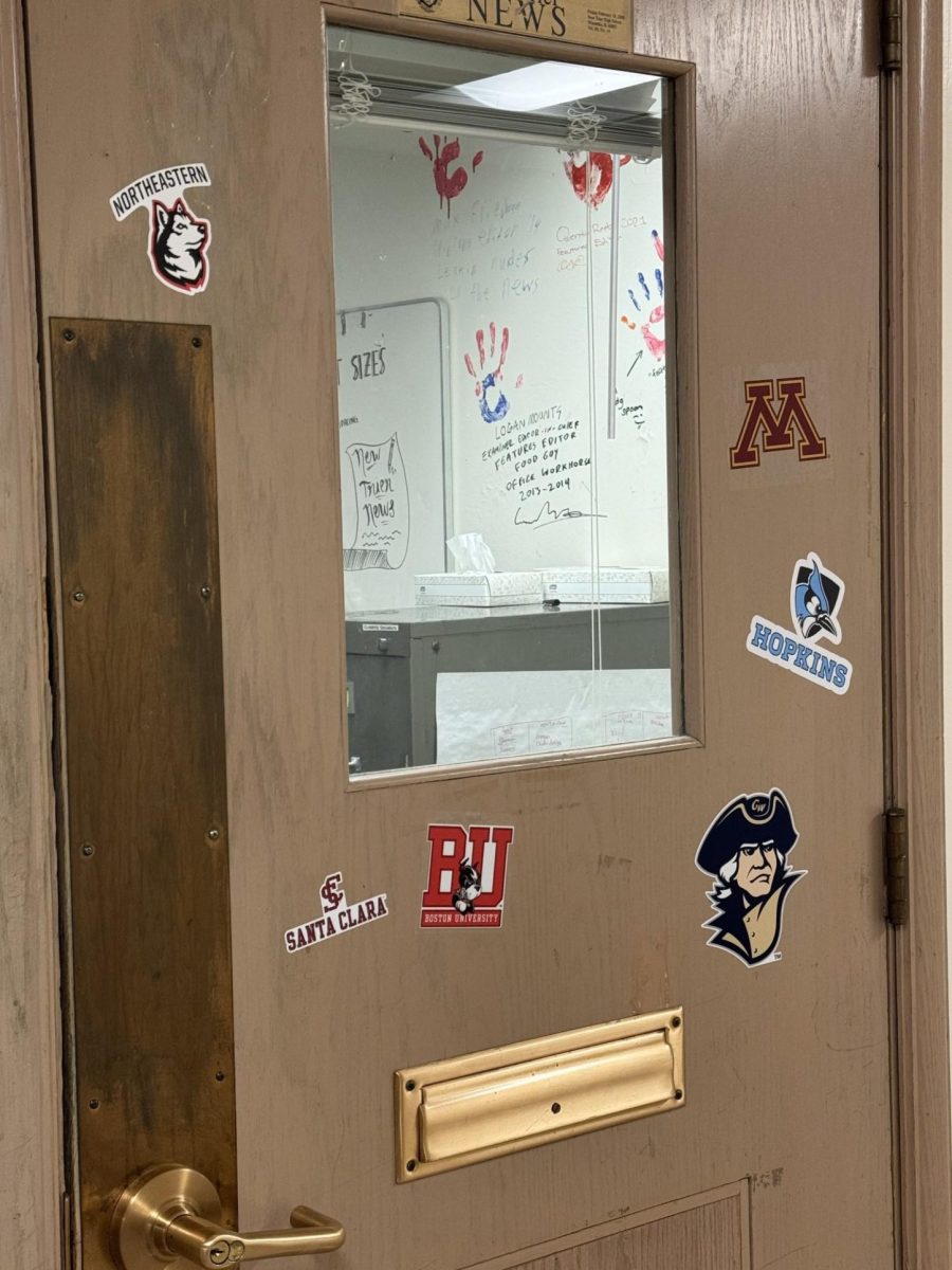 The door of our newsroom with the stickers of our seniors future schools