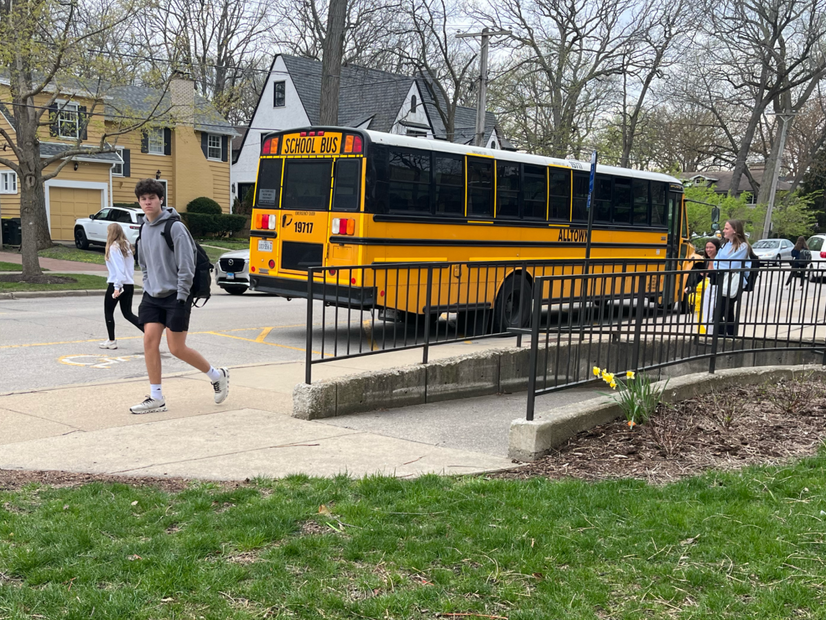 A signature school bus awaits students on Winnetka Avenue, as some classes struggle with field trip scheduling