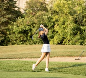 Leber hits with her 9-iron club during a recent practice at Deerfield Golf Club