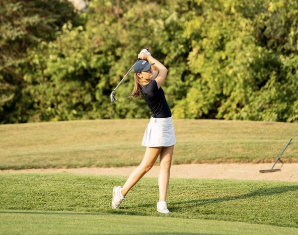 Leber hits with her 9-iron club during a recent practice at Deerfield Golf Club