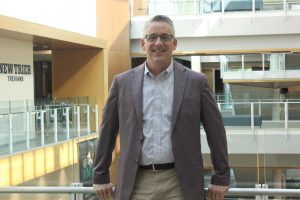 Superintendent Dr. Paul Sally stands on the second floor of New Trier's Winnetka Campus