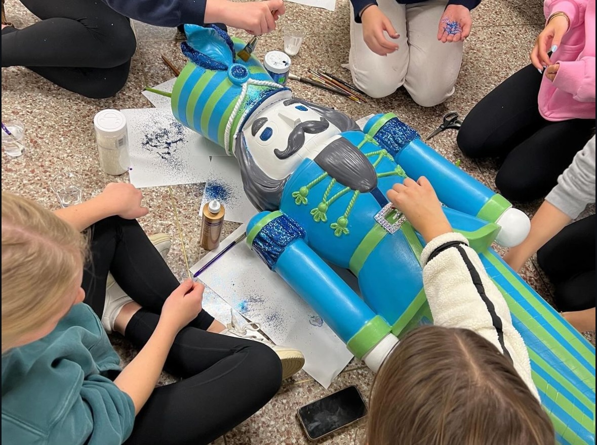 Girls Club members paint a Nutcracker for the Rosemont Theatre in Rosemont, Illinois