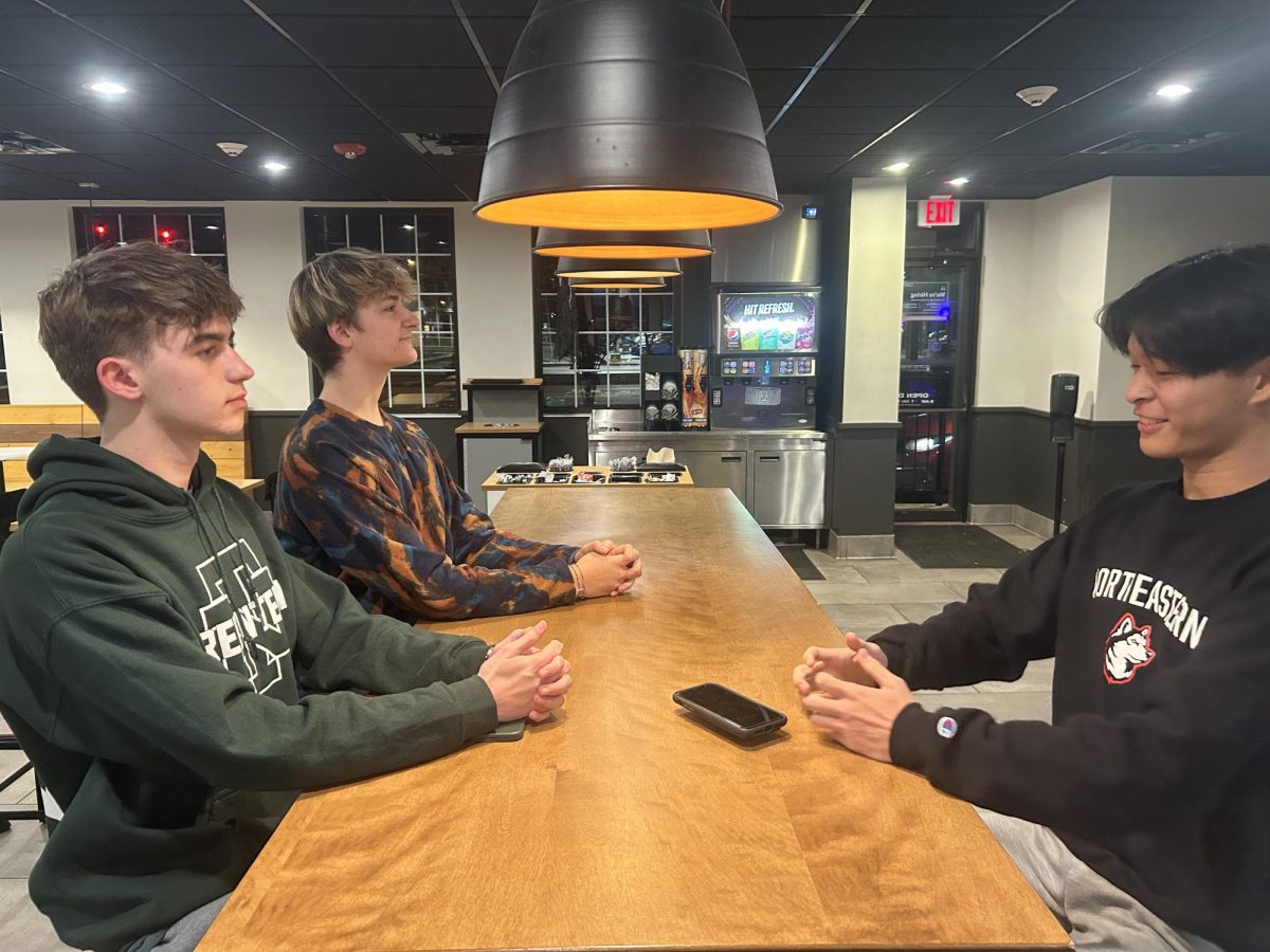 Seniors Aaron Hill, Adam Pulijic, and Will Shin (left to right) at the Taco Bell in Glenview, Illinois