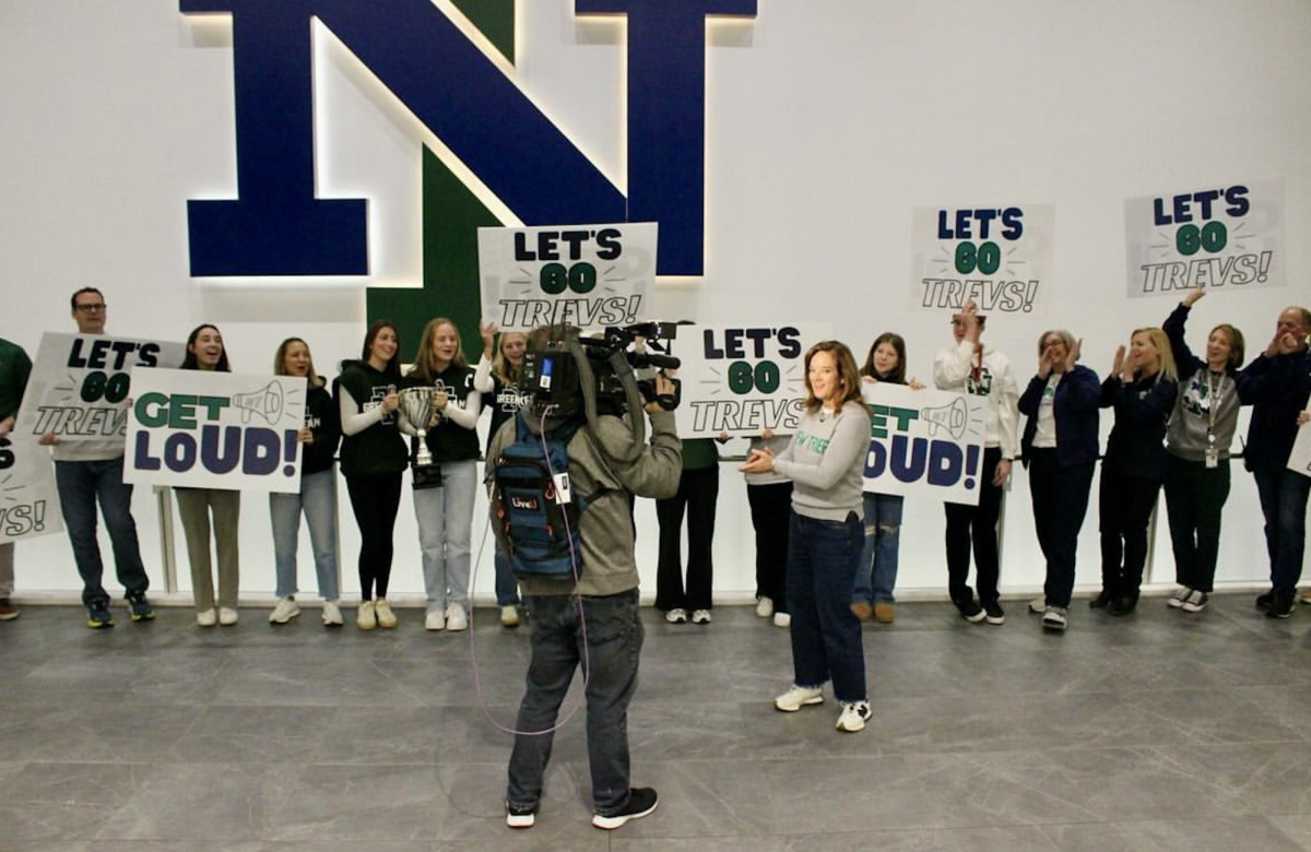 Principal Denise Dubravec and Student Council Members celebrate the win in the E-Building