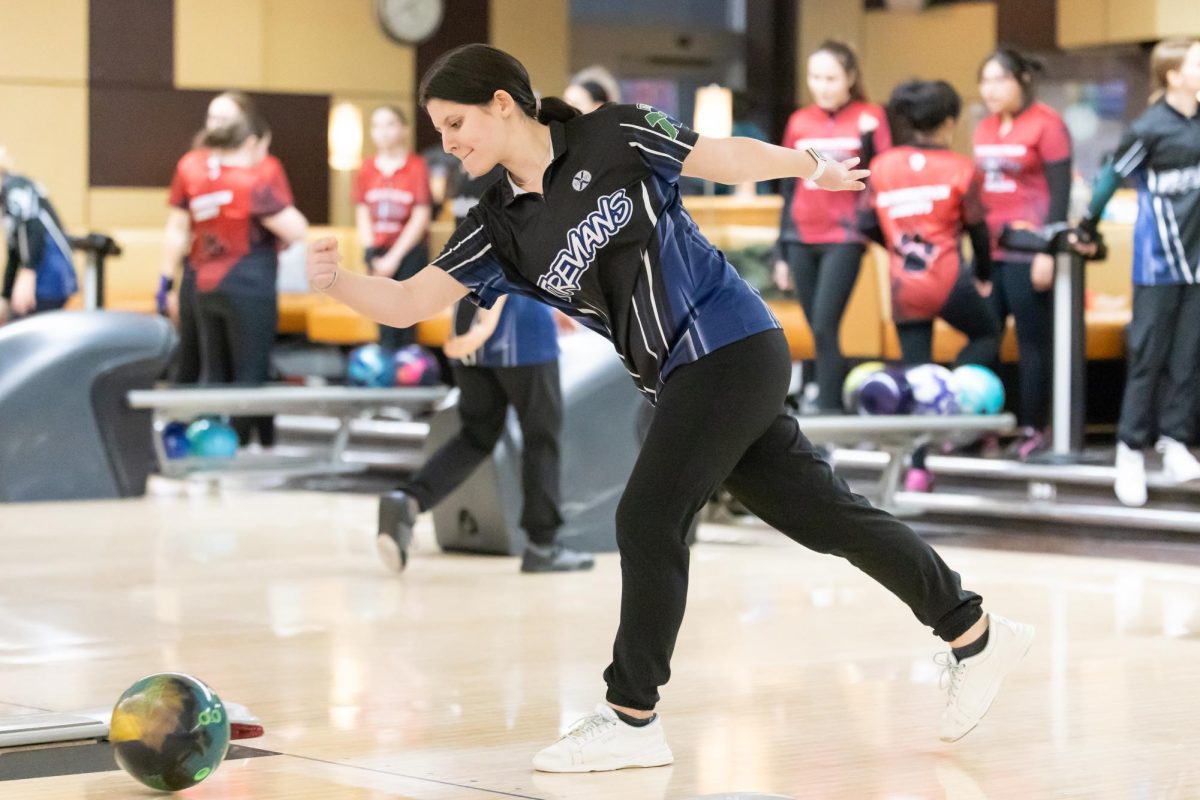 Senior Becky Witzel bowls at a match against Resurrection College Prep High School on Dec. 12, 2024