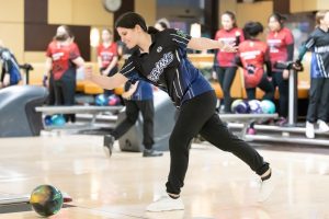 Senior Becky Witzel bowls at a match against Resurrection College Prep High School on Dec. 12, 2024