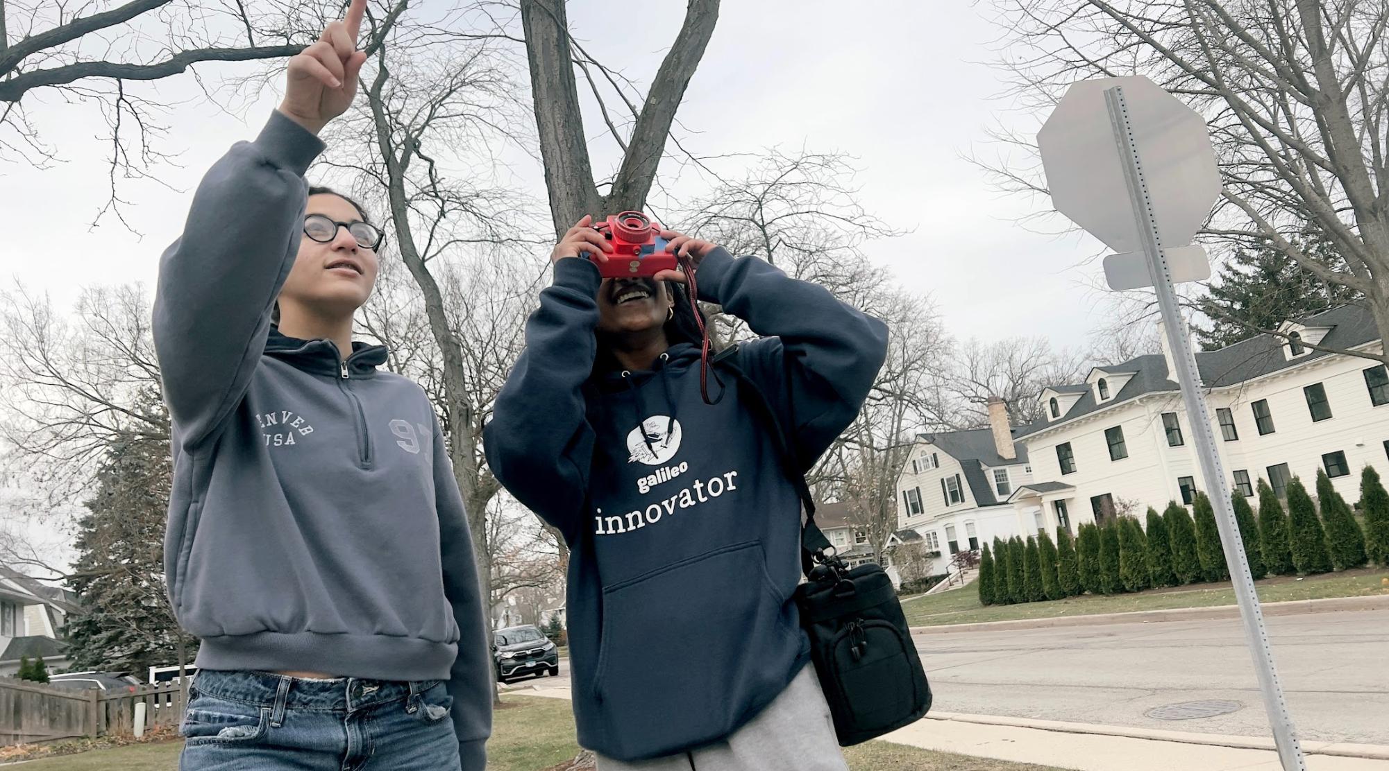 Students Anisha and Camille work together to get the perfect shot 