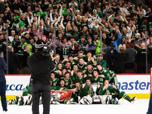 New Trier Green poses for a photo after securing their 1-0 win on March 16 at the United Center