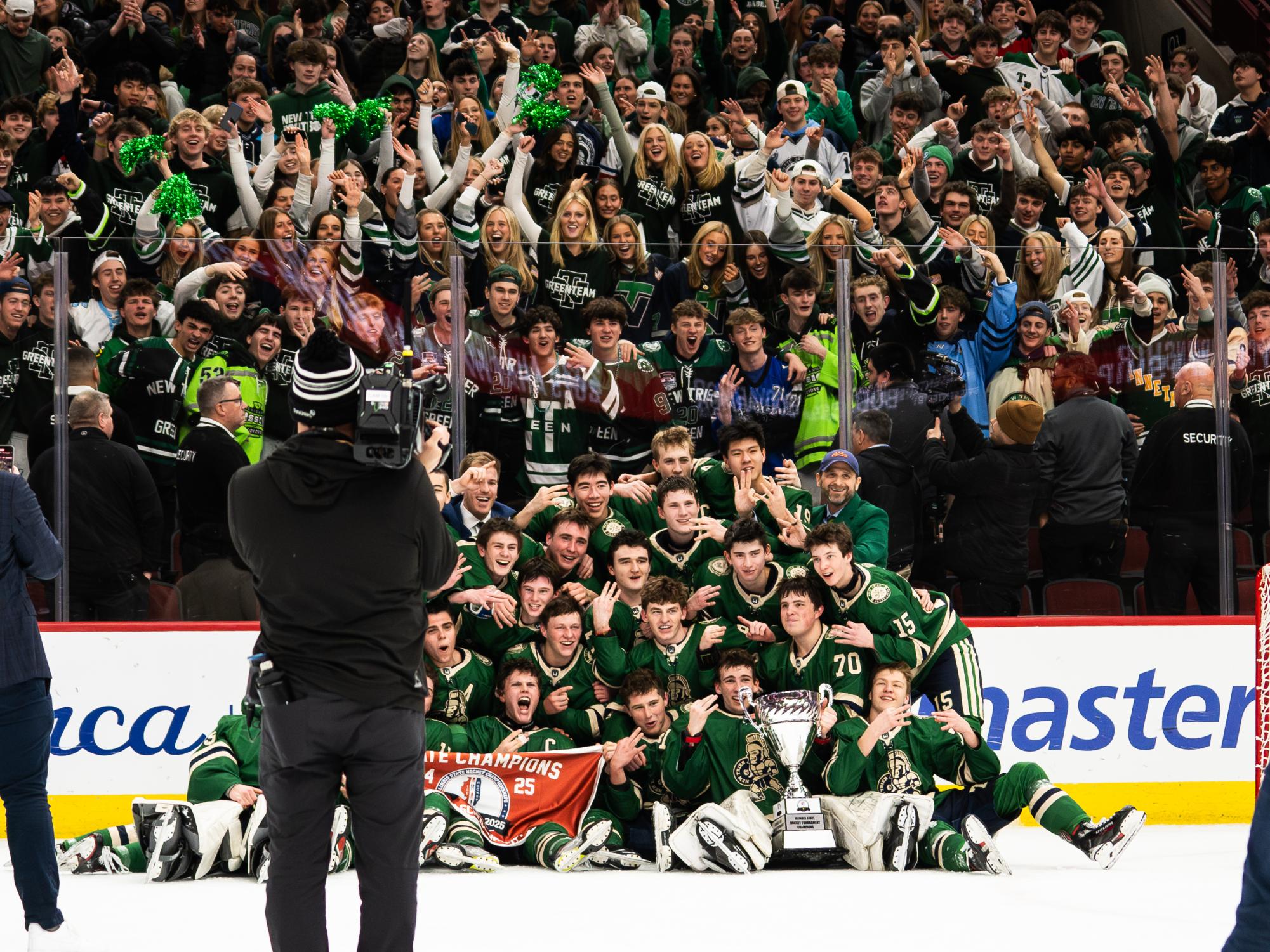 New Trier Green poses for a photo after securing their 1-0 win on March 16 at the United Center