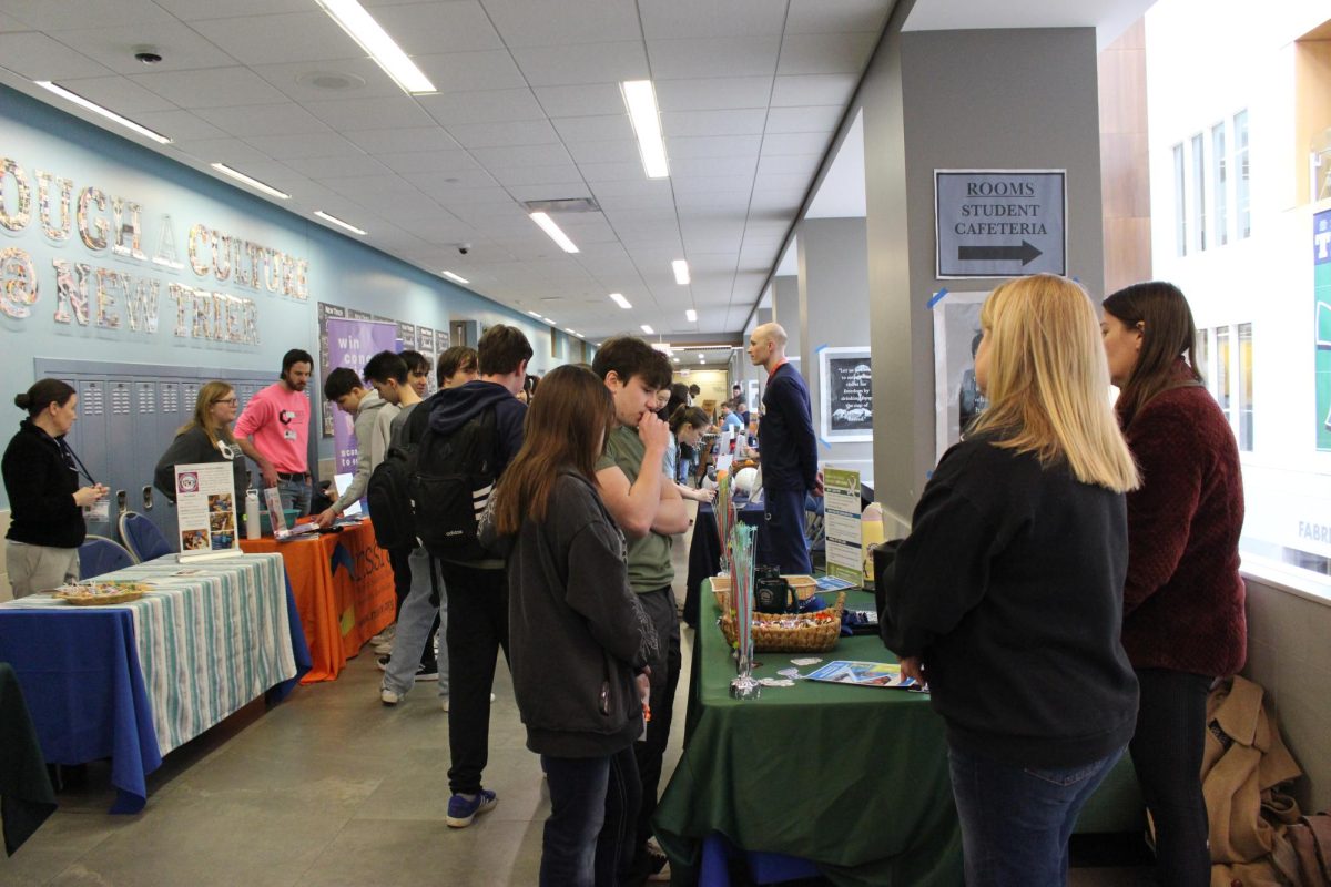 Job fair booths set up outside cafeteria 